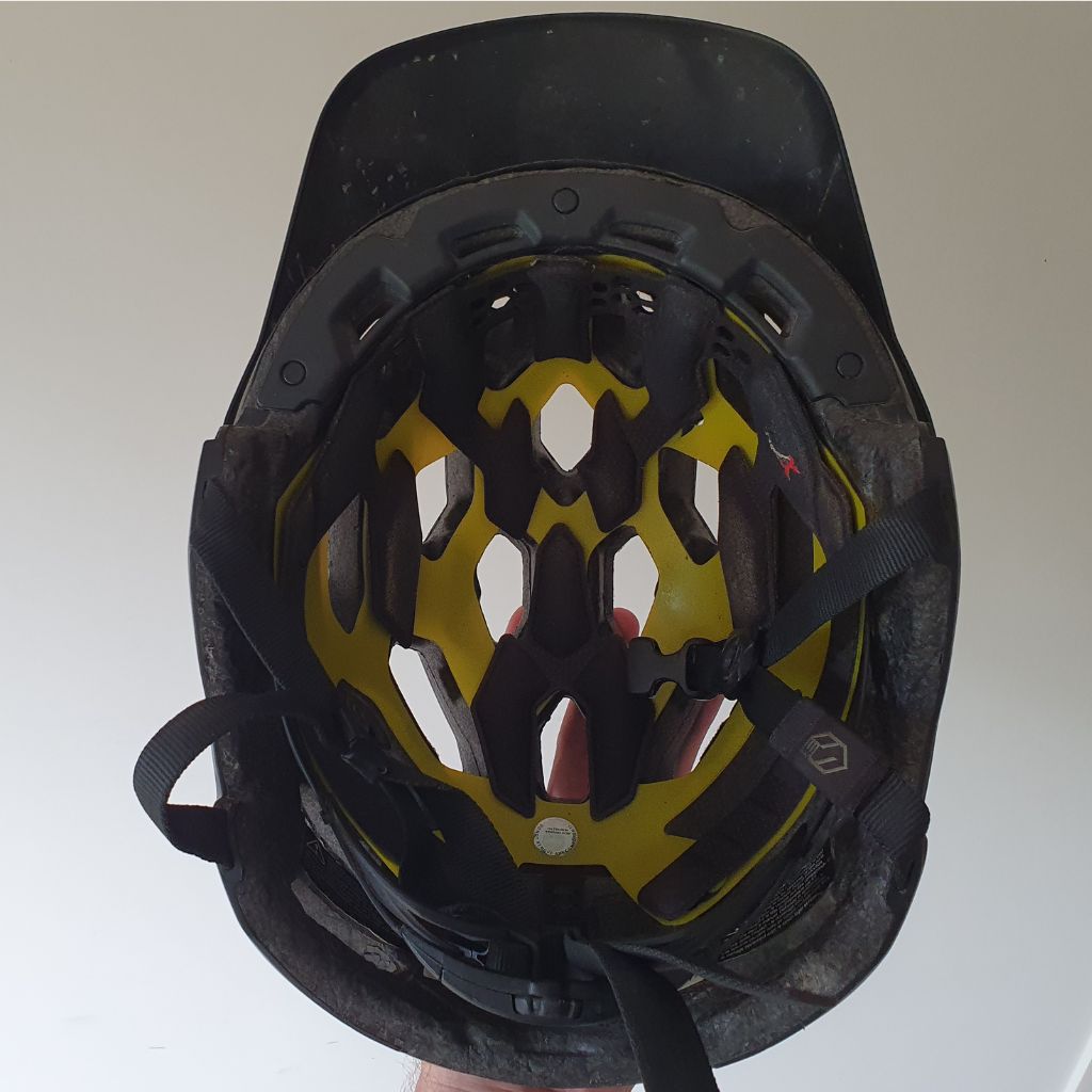 Battered worn mountain bike helmet I've been using for many years.